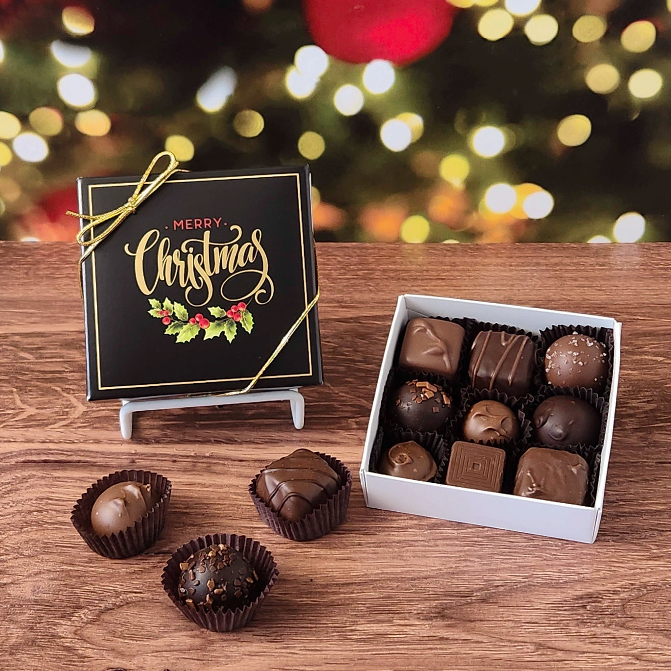 9 Piece chocolate assortment in Merry Christmas decorative box.  filled with a variety of creams, caramels, melt-aways and  truffles.