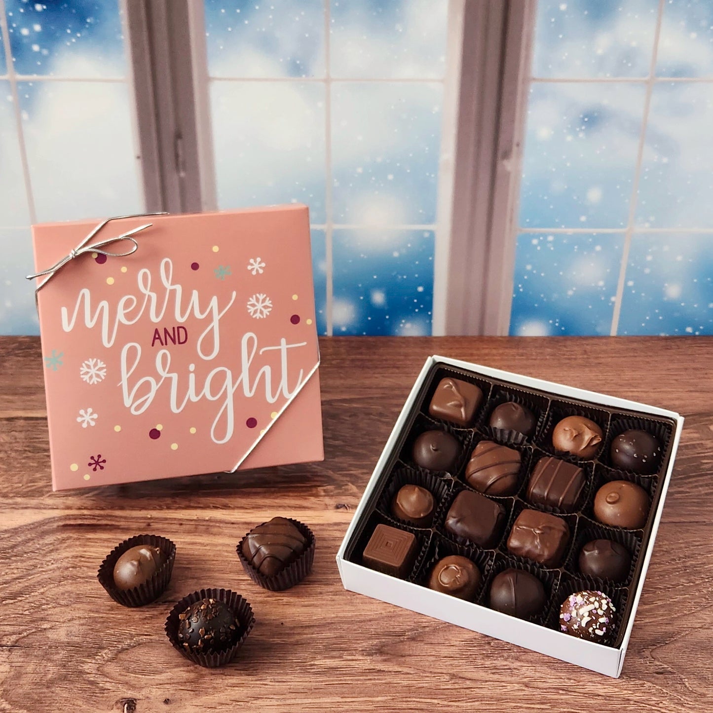 16 Piece Merry and Bright Holiday Chocolate Box.  Inside, you'll find a handpicked assortment of our most popular milk and dark chocolates. Think creamy centers, buttery caramels, dreamy melt-aways, and decadent truffles