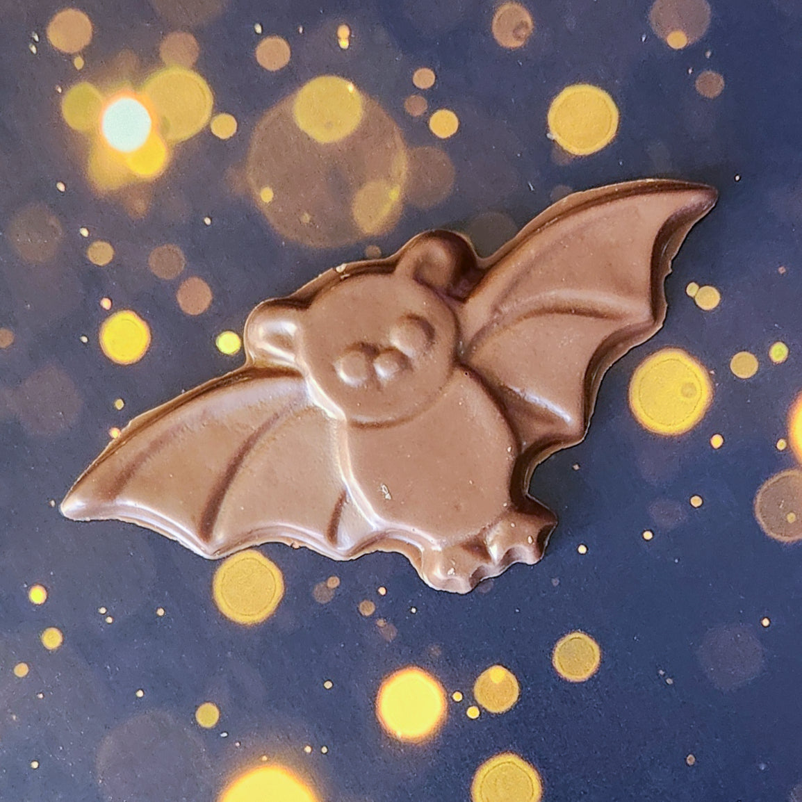 Milk Chocolate Bat Favor. Measuring approximately 4.75 inches wide by 2.25 inches tall and weighing around 28 grams, these chocolate bats are just the right size for a sweet snack