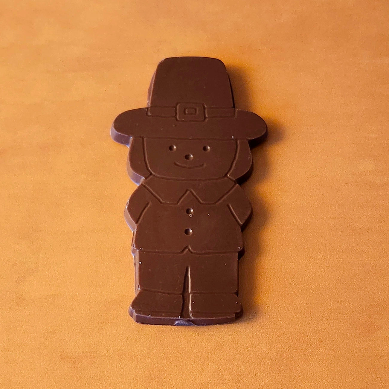 Add a touch of holiday tradition to your Thanksgiving celebrations with our Boy Pilgrim Chocolate Favor. Available in smooth milk chocolate or rich dark chocolate, this adorable pilgrim-shaped treat is perfect as a table favor, a small gift, or a delicious addition to your dessert table