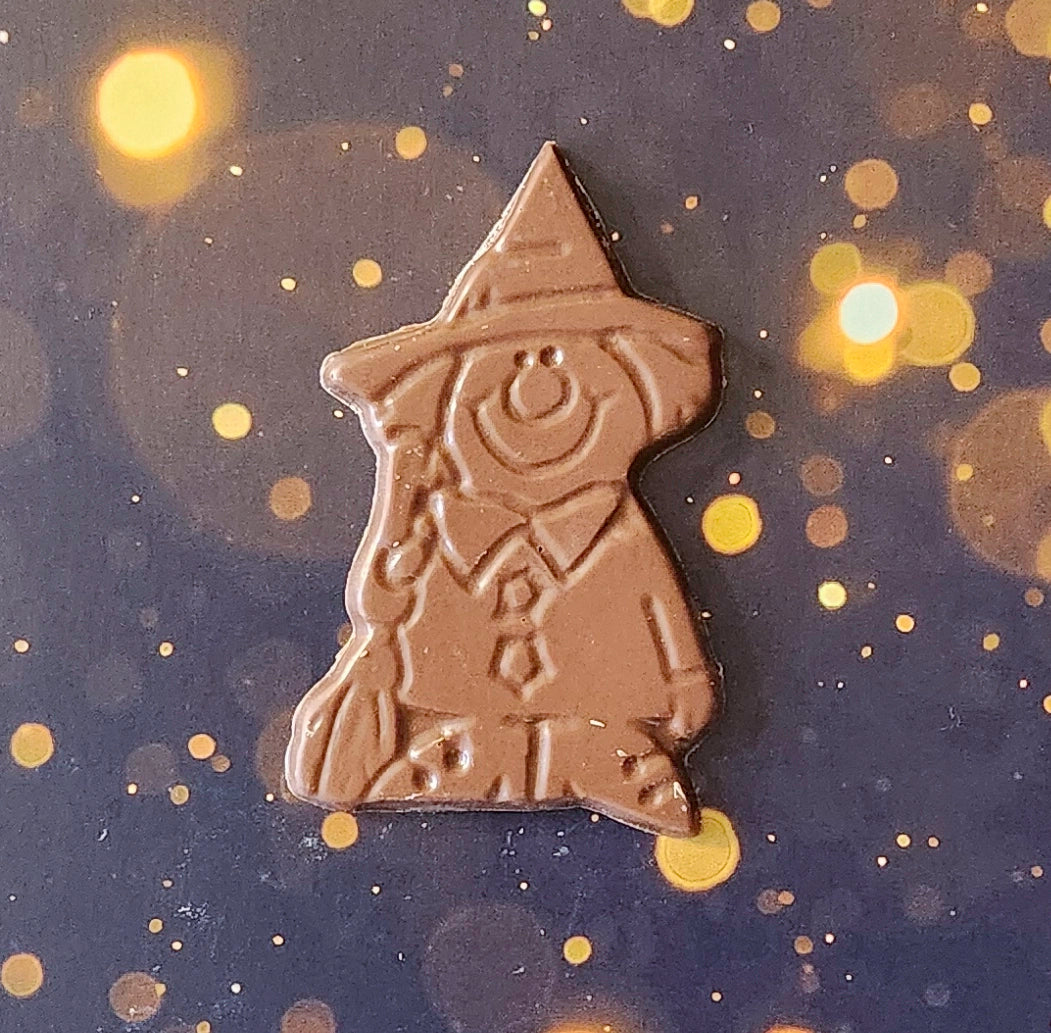 Cast a delicious spell this Halloween with our Enchanting Chocolate Witch! Made from the finest milk chocolate, this delightful witch is here to bring joy and sweetness to your celebrations. 