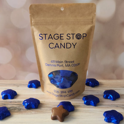 Delicious Milk Chocolate Stars covered in a vibrant blue foil.