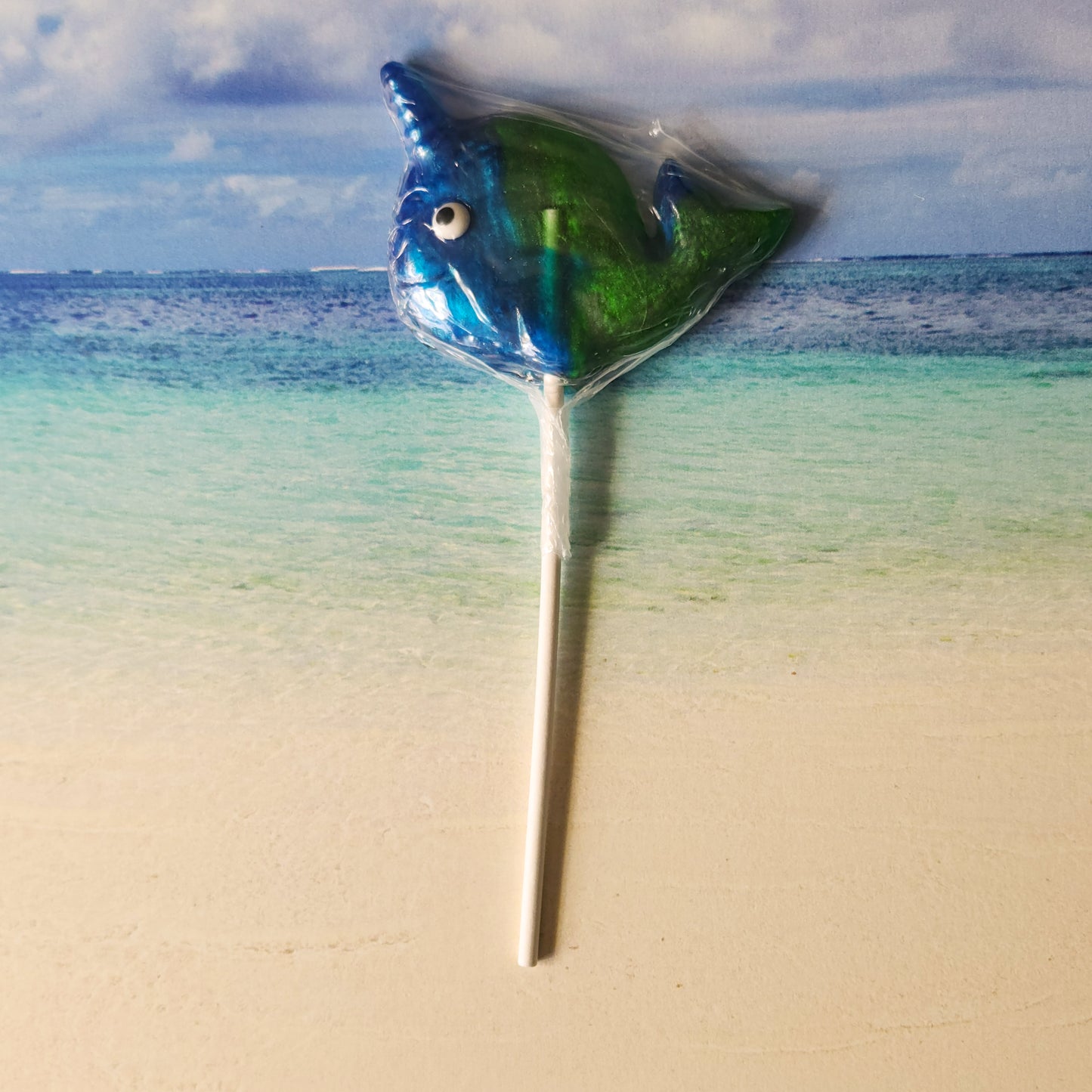 Refreshing fruit punch is the flavor of this fun narwhal shaped hard candy lollipop.