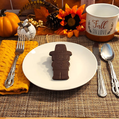 Add a touch of whimsy to your Thanksgiving celebrations with these delightful dark chocolate pilgrims