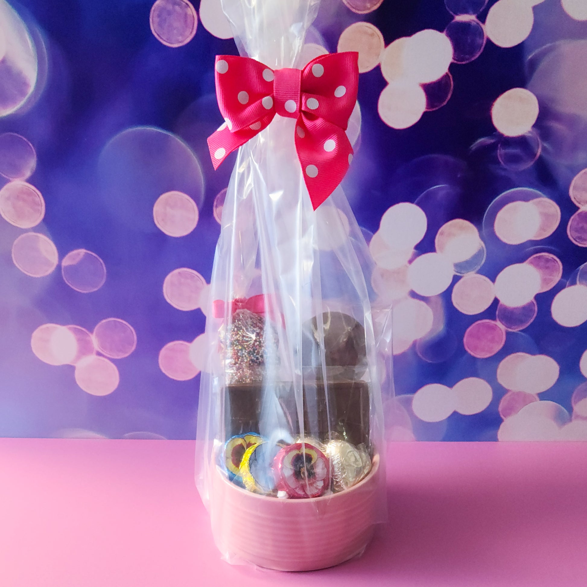 Tell mom how much she means to you this Mother's Day with a pastel pink candy dish filled with all of mom's favorite candies.
