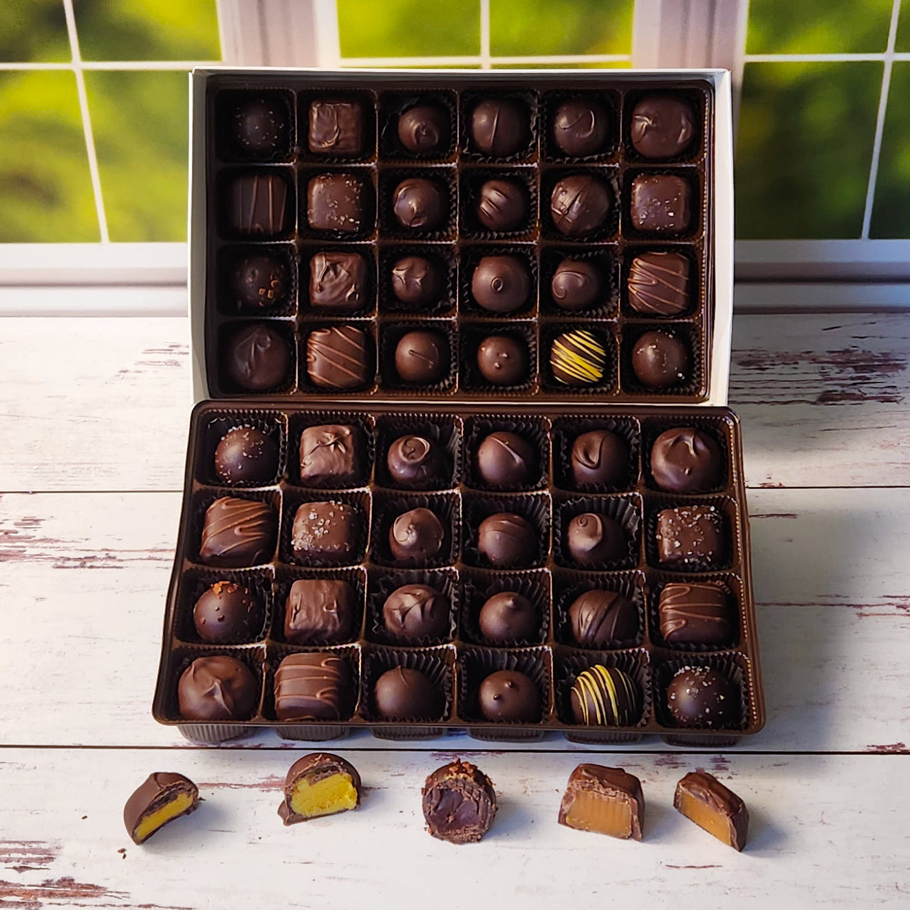 This 48 Piece box comes with 2 layers of all dark chocolate creams, caramels and truffles making it perfect to share at office events, family parties or more! 