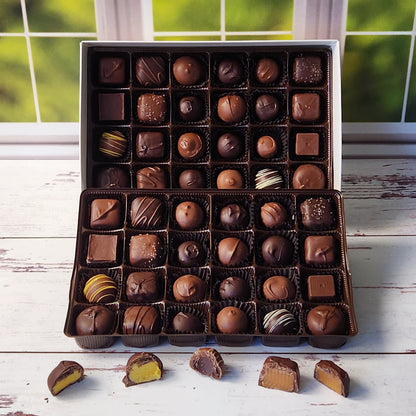 This 48 Piece box comes with 2 layers of Milk Chocolate and Dark chocolate creams, caramels and truffles making it perfect to share at office events, family parties or more! 