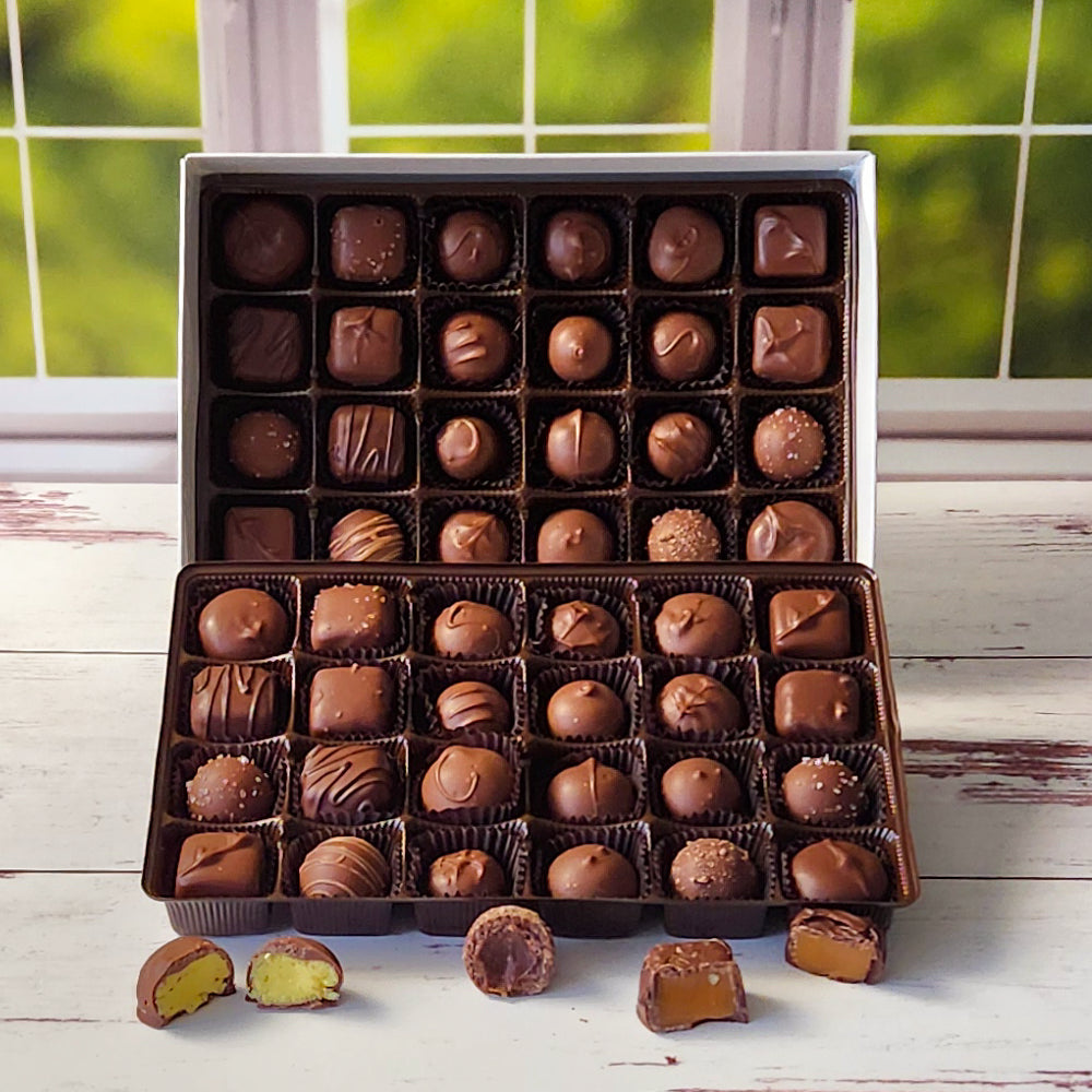 A large Milk Chocolate assortment featuring all of our most popular pieces. Including hand rolled creams, gooey caramels, decedent truffles and divine meltaways. This box is large enough for sharing at a party or bring to an office for all to enjoy.