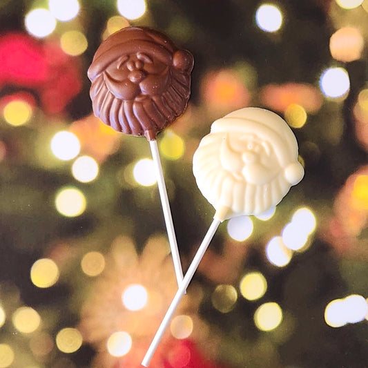 Celebrate the season with our Santa Face Lollipop! This whimsical treat, crafted in the shape of Santa’s jolly face, brings an extra dose of holiday cheer with every bite. Available in smooth Milk Chocolate,  or creamy White Chocolate, it’s a fun and festive way to enjoy a holiday classic.