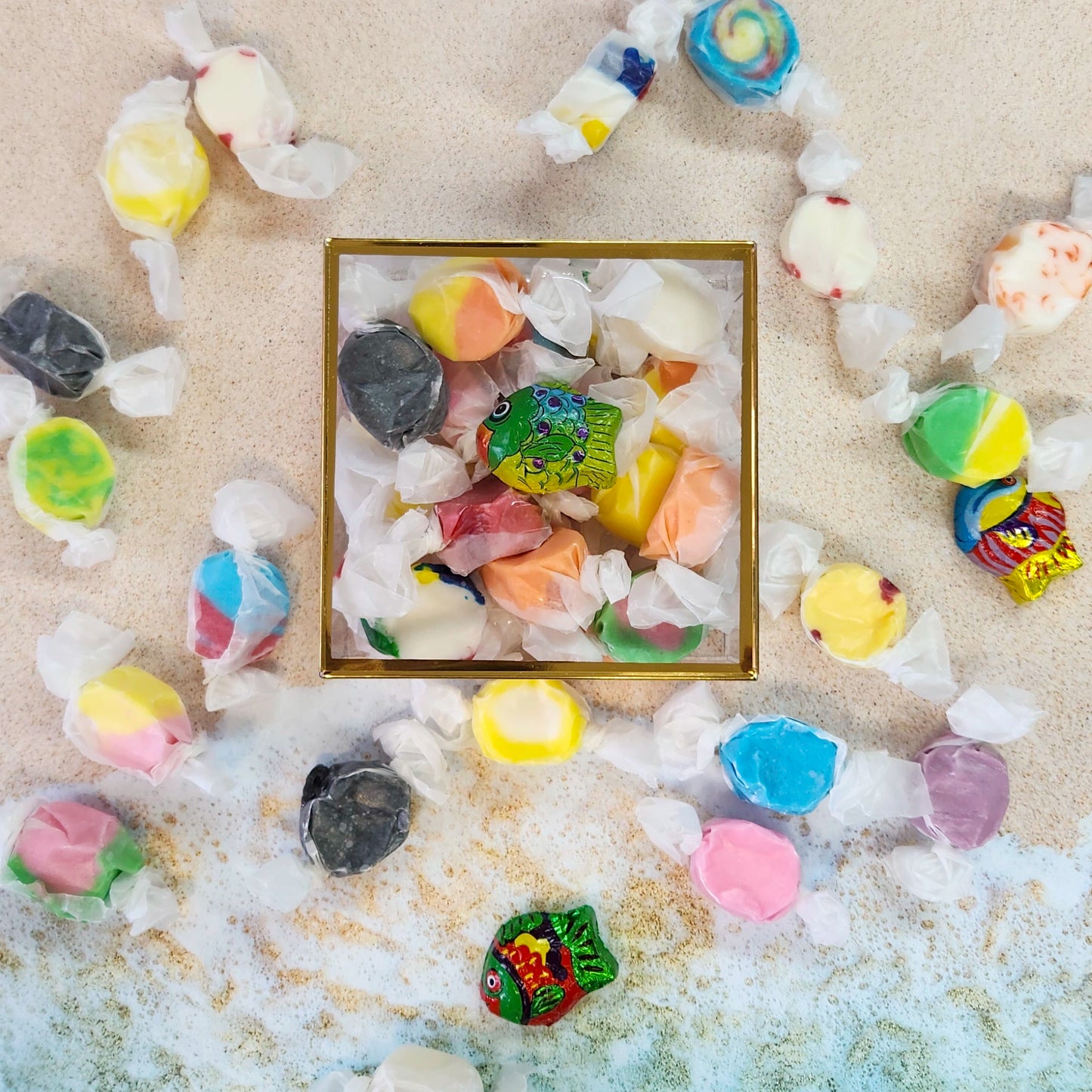 Inside this cheerful gift box, you’ll find 6 ounces of our signature salt water taffy, bursting with nostalgic flavors like strawberry, lemon, orange, and more.  Tucked beside the taffy is a whimsical bite-sized milk chocolate fish, wrapped in bright foil and ready to make waves. 