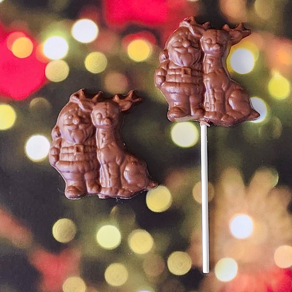 Celebrate the magic of the season with our Milk Chocolate Santa and Reindeer! This delightful treat features a charming design of Santa and his trusty reindeer, crafted from creamy milk chocolate. Available as a favor or a fun lollipop, it’s the perfect addition to stockings, party favors, or holiday gift bags.