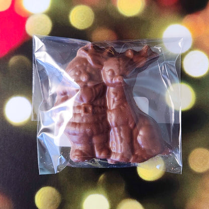 Celebrate the magic of the season with our Milk Chocolate Santa and Reindeer favor! This delightful treat features a charming design of Santa and his trusty reindeer, crafted from creamy milk chocolate. 