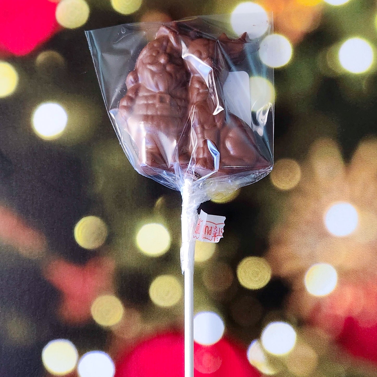 Celebrate the magic of the season with our Milk Chocolate Santa and Reindeer lollipop! This delightful treat features a charming design of Santa and his trusty reindeer, crafted from creamy milk chocolate. 