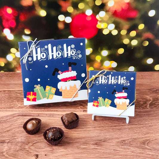 Santa in Chimney Chocolate Assortment filled with a variety of creams, caramels, melt-aways and  truffles.
Available in your choice of either 9 piece or 16 piece boxes