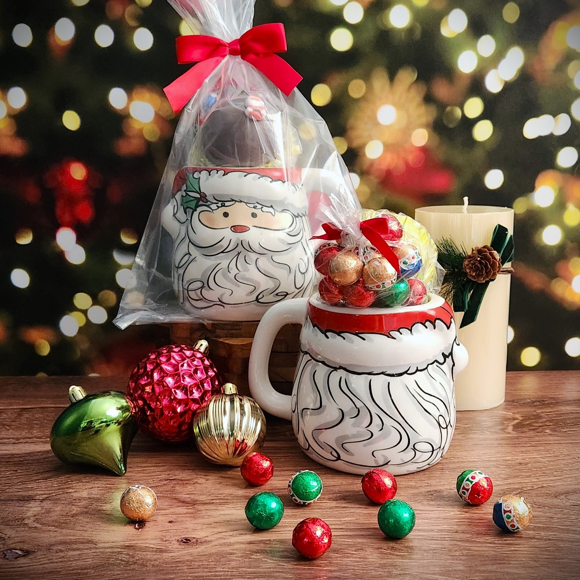 Enjoy hot cocoa with marshmallows in this delightful ceramic mug adorned with a Santa Face. Complete with a Milk Chocolate Hot Cocoa Bomb and Foiled Ornaments, it's the perfect gifting option, all wrapped up with a bow!