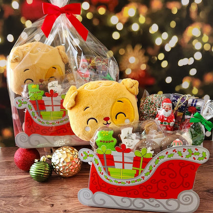 A holiday gift for everyone! Includes a cute stuffed animal and assortment of festive holiday chocolates and treats. 