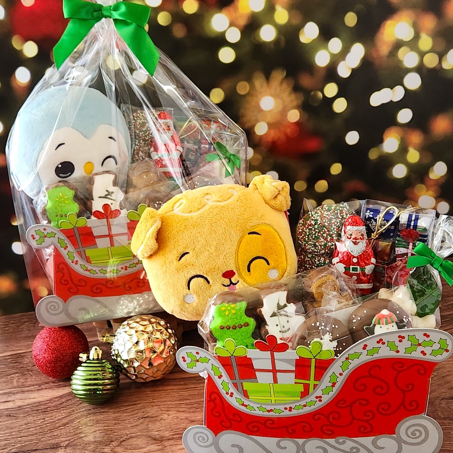 A cute Christmas gift including stuffed animal, Milk Chocolate Foiled Presents, Foiled Santa Claus, Chocolate dipped Peeps, nonpareils, festive Holiday Oreos, and a bag of Holiday Gummi! 