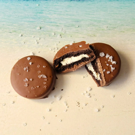 Delicious Oreo Cookies dipped in milk chocolate and sprinkled with salt for a sweet and salty snack.