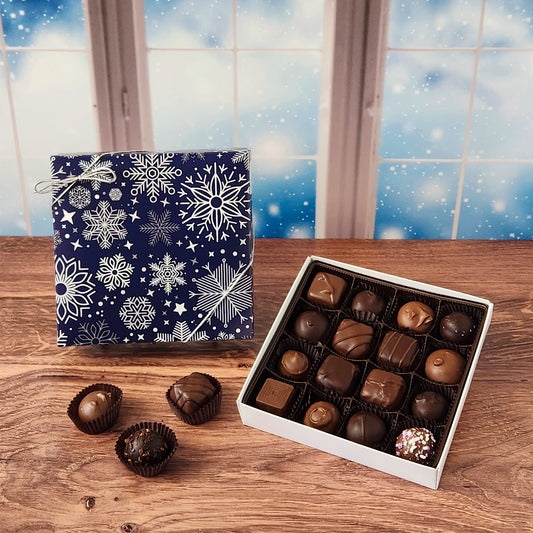 16 piece Winter Snowflakes Chocolate Assortment.  Inside this decorative box is a handpicked selection of our most popular milk and dark chocolates. You’ll discover a variety of gooey caramels, rich truffles, creamy centers, and smooth melt-aways.  