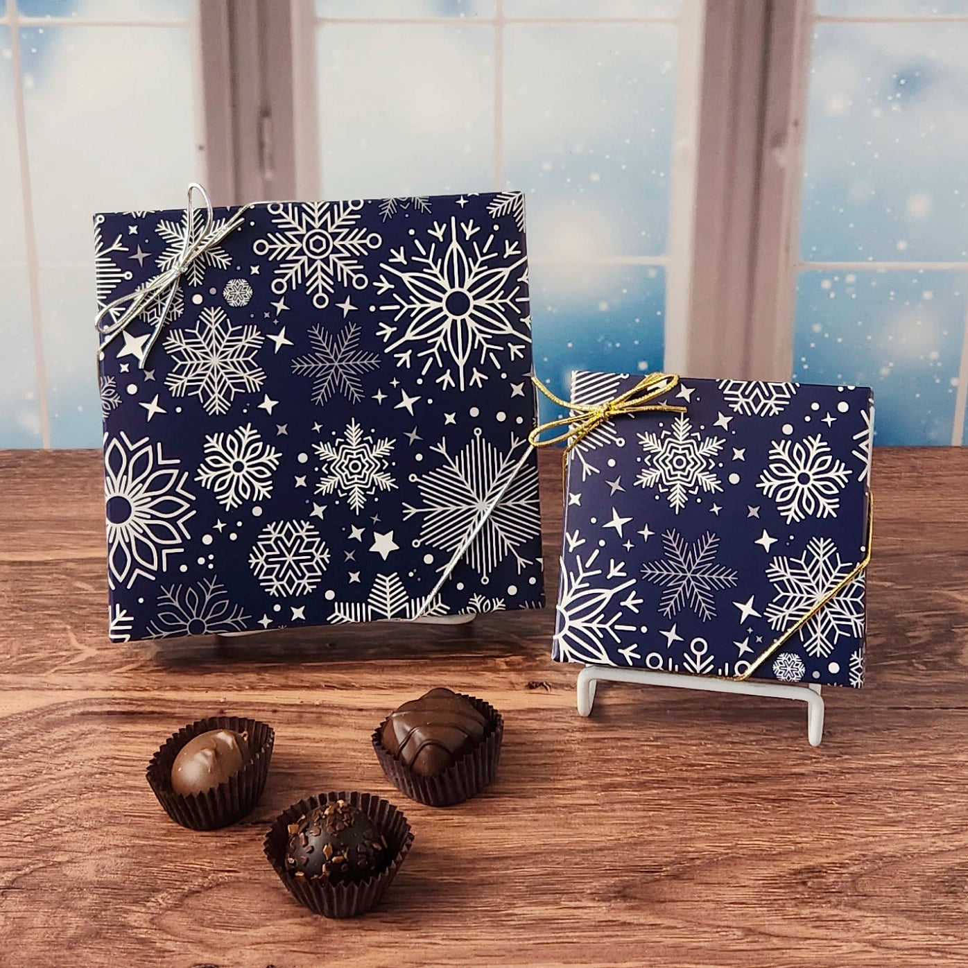 Winter Snowflakes Chocolate Assortment.  Inside this decorative box is a handpicked selection of our most popular milk and dark chocolates. You’ll discover a variety of gooey caramels, rich truffles, creamy centers, and smooth melt-aways.  Available in your choice of 9 or 16 pieces