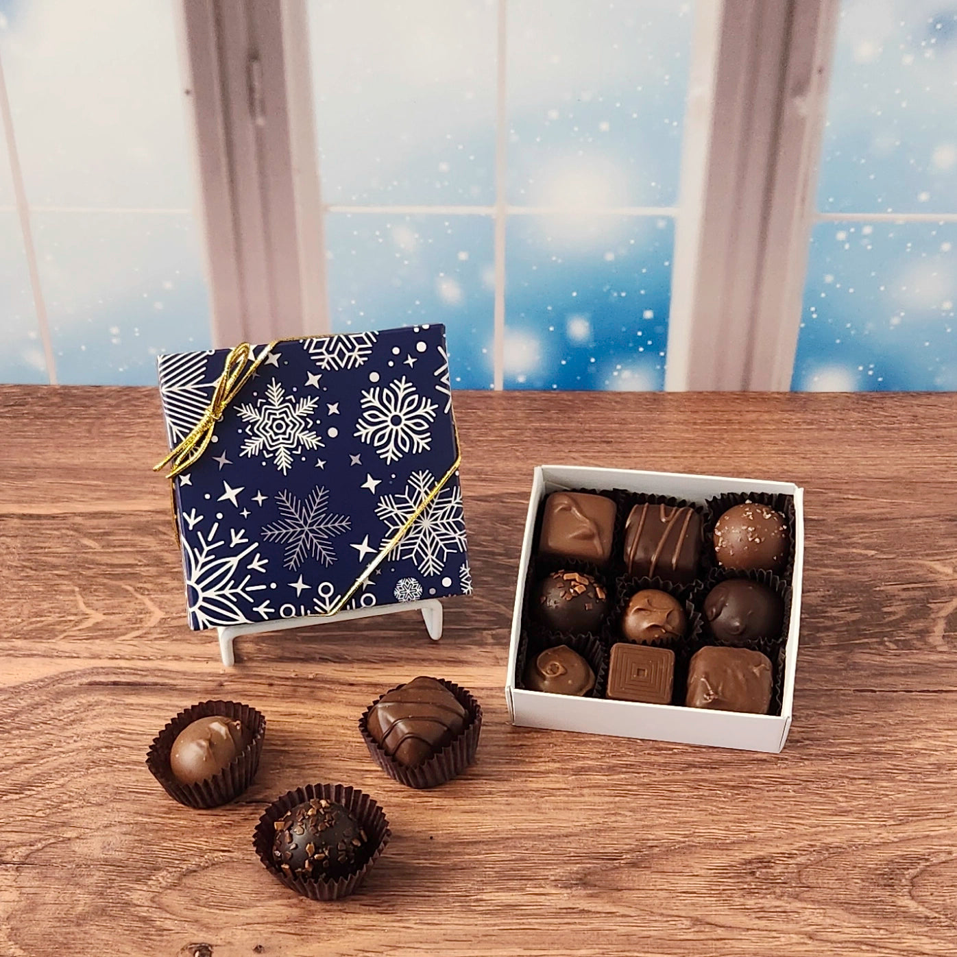 9 piece Winter Snowflakes Chocolate Assortment.  Inside this decorative box is a handpicked selection of our most popular milk and dark chocolates. You’ll discover a variety of gooey caramels, rich truffles, creamy centers, and smooth melt-aways.  