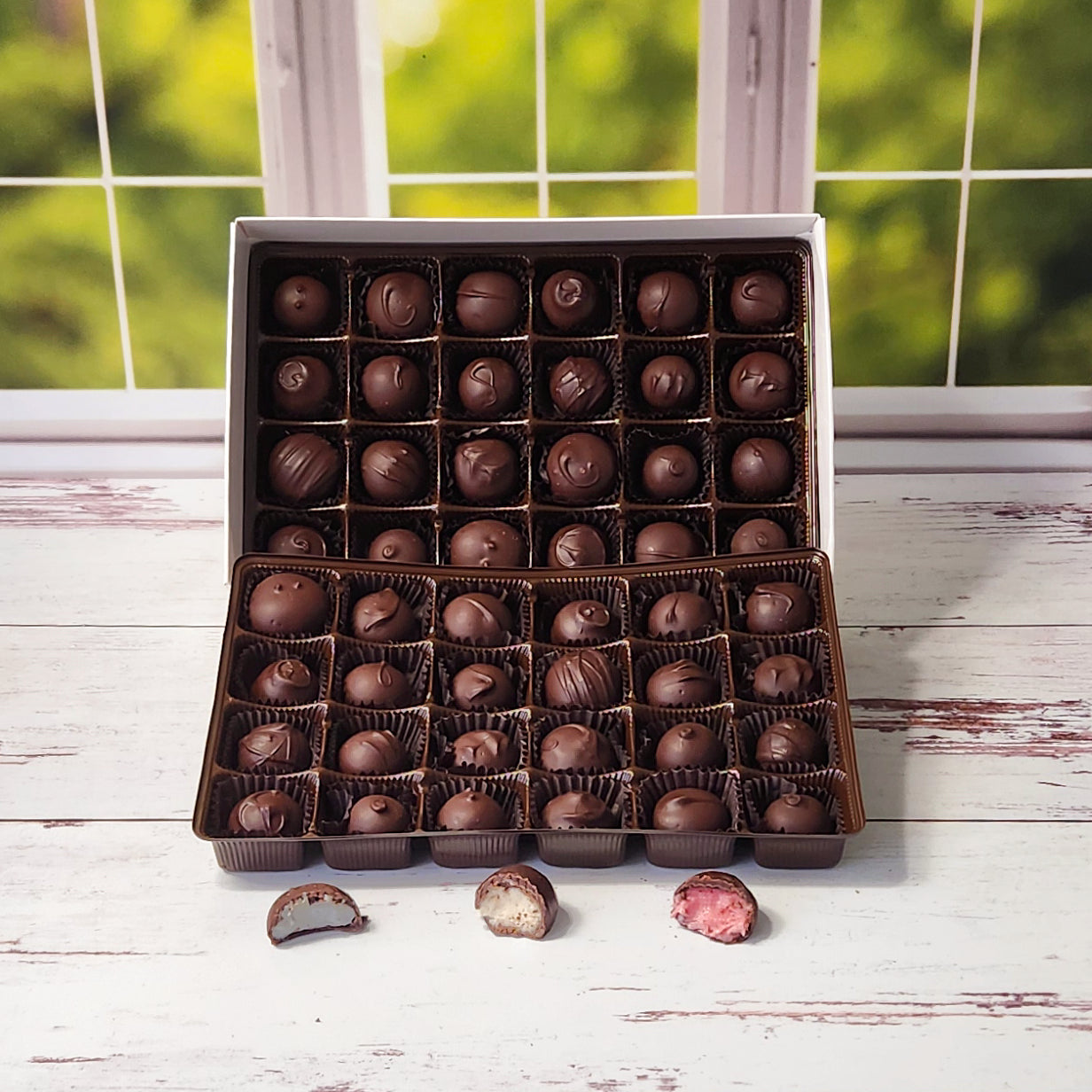 This 48 piece all dark chocolate soft center cream assortment is perfect for sharing! Filled with all our different creams from Blueberry to Vanilla there is a flavor for everyone!