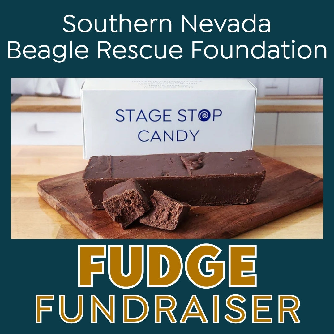 Promotional graphic for a 'Southern Nevada Beagle Rescue Foundation Fudge Fundraiser' featuring a bar of chocolate fudge and pieces on a wooden cutting board in front of a white box labeled 'STAGE STOP CANDY'. The graphic has a dark teal background with white and gold text.
