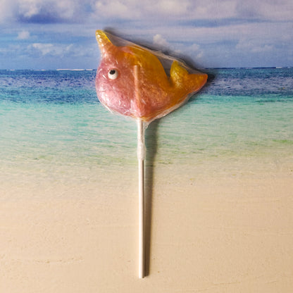 Sweet strawberries mixed with fruity banana flavors mix playfully in this fun narwhal shaped hard candy lollipop.