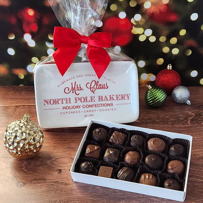 Enjoy  a 15 piece popular assortment of Stage Stop Candy's milk and dark chocolates on a candy tray saying "Mrs. Claus North Pole Bakery"