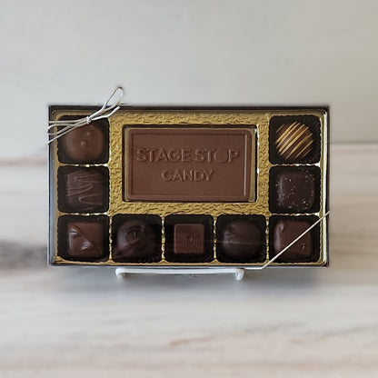 A solid milk chocolate bar embossed with the Stage Stop Candy logo is front and center of this yummy chocolate assortment. Surrounded by 9 creams, caramels, truffles and meltaways this assortment makes the perfect Cape Cod Gift.