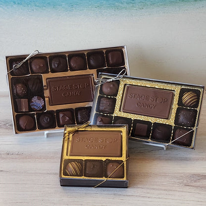 A milk and dark chocolate assortment that has a solid milk chocolate card embossed with the Stage Stop Candy Logo. Surrounded by soft center creams, caramels, truffles and meltaways.