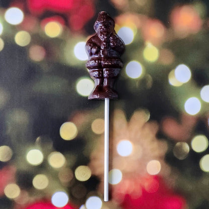 Celebrate the season with our Standing Santa Lollipop—a delightful holiday favorite crafted to resemble jolly Old Saint Nick himself! Made from premium dark chocolate molded into a cheerful Santa Claus, this lollipop is perfect as a festive stocking stuffer, a thoughtful holiday gift, or a sweet treat for yourself!