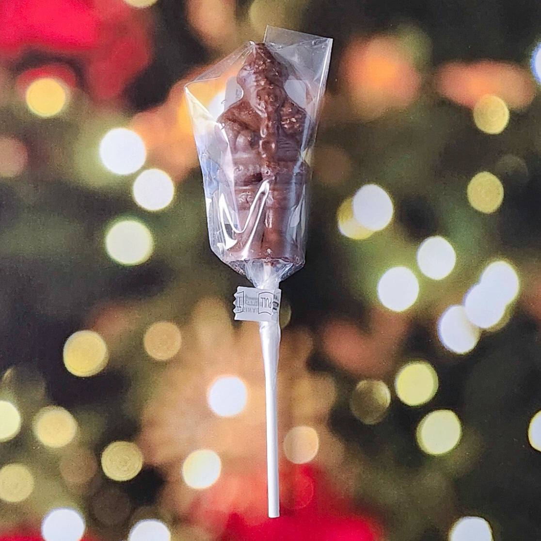 Celebrate the season with our Standing Santa Lollipop—a delightful holiday favorite crafted to resemble jolly Old Saint Nick himself! Made from premium milk chocolate molded into a cheerful Santa Claus, this lollipop is perfect as a festive stocking stuffer, a thoughtful holiday gift, or a sweet treat for yourself!