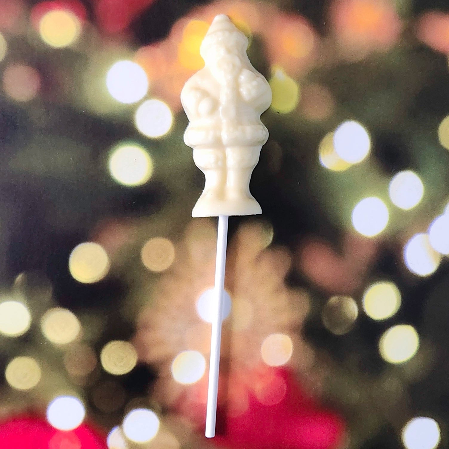 Celebrate the season with our Standing Santa Lollipop—a delightful holiday favorite crafted to resemble jolly Old Saint Nick himself! Made from premium white chocolate molded into a cheerful Santa Claus, this lollipop is perfect as a festive stocking stuffer, a thoughtful holiday gift, or a sweet treat for yourself!