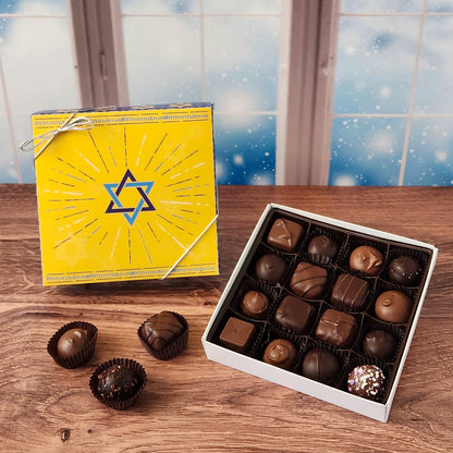 16 Piece Star Of David Chocolate Assortment.  Inside this festive box is a handpicked selection of our most popular milk and dark chocolates.   You’ll discover a variety of gooey caramels, rich truffles, creamy centers, and smooth melt-aways