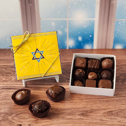 9 Piece Star Of David Chocolate Assortment.  Inside this festive box is a handpicked selection of our most popular milk and dark chocolates.   You’ll discover a variety of gooey caramels, rich truffles, creamy centers, and smooth melt-aways