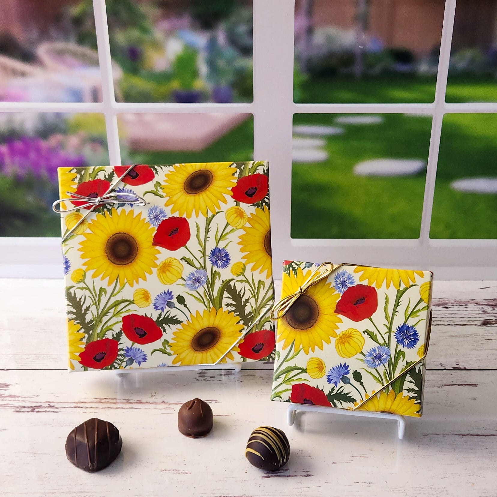 An assortment of our most popular milk and dark chocolate creams, caramels, melt-aways, and truffles all packed inside a Sunflower and Poppies printed box.