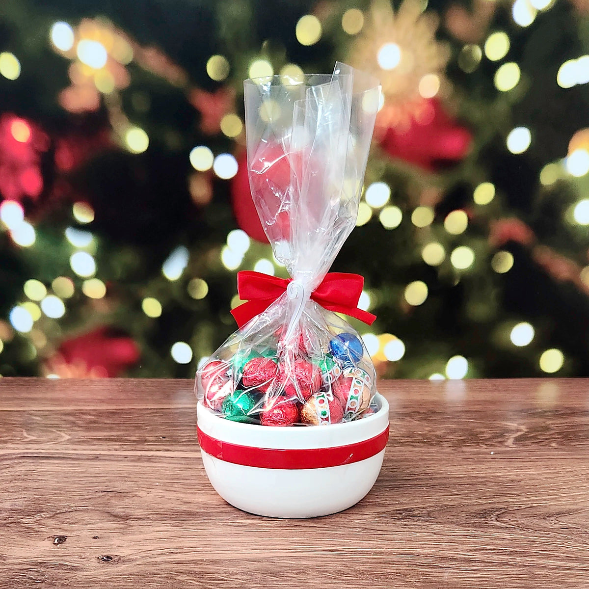 Sweet Tidings Candy Dish, the Red Bow bowl from the back, a red band around the white bowl with bagged foil chocolates