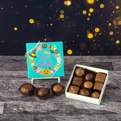 This Sweet and Spooky Assortment Box is a collection of our popular handmade chocolates. Available in 9-piece or 16-piece boxes, this assortment features a mix of milk and dark chocolate truffles, creams, caramels, and meltaways.