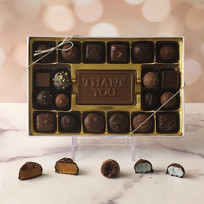 Show your appreciation with our 20-piece Thank You Candy Box! Inside, a beautifully crafted milk chocolate card that says "Thank You" is surrounded by a delectable assortment of milk and dark chocolate soft center creams, luxurious truffles, and luscious caramels. It's the perfect way to express your gratitude and make someone's day extra special!