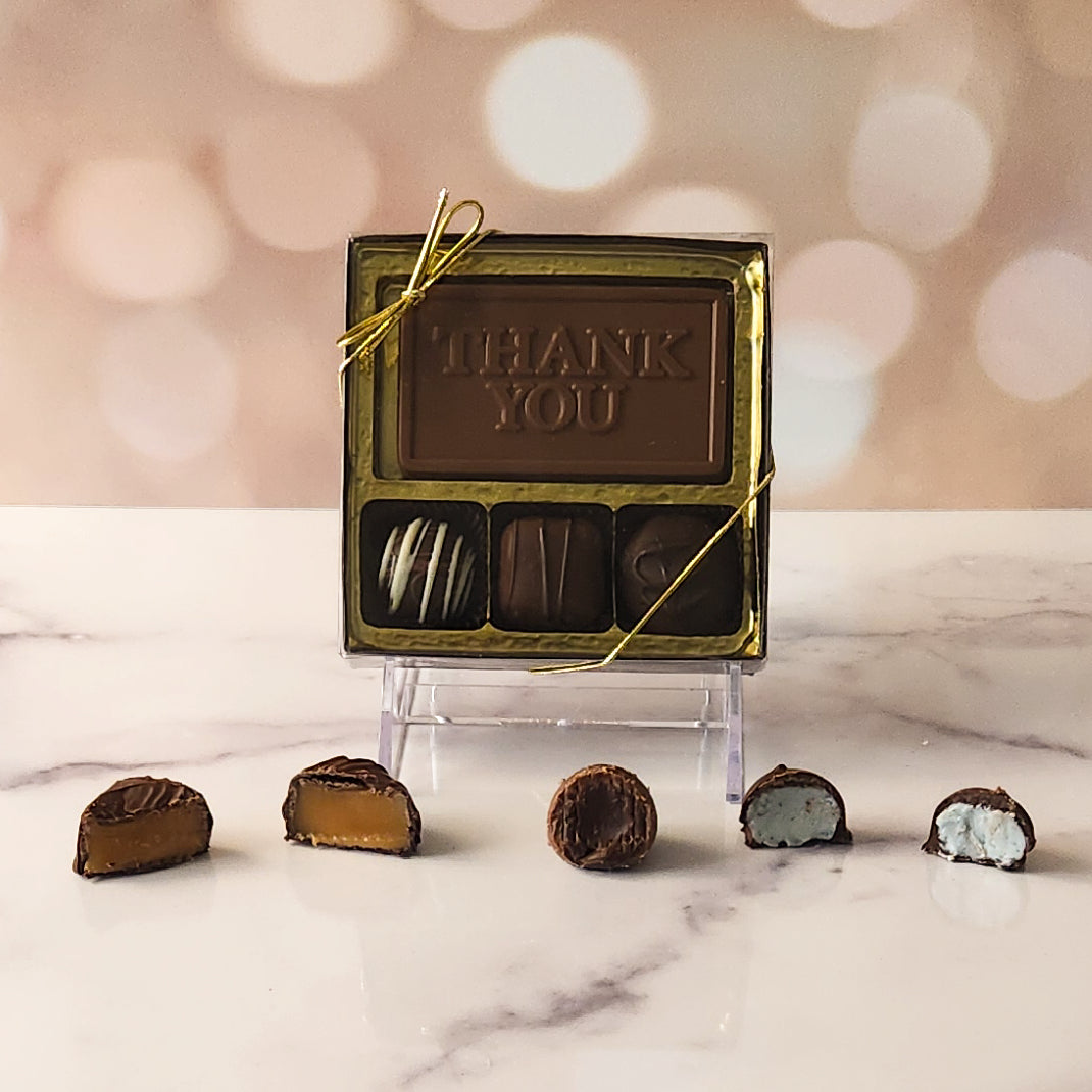  Express your gratitude with our 3-piece Thank You Candy Box! Inside, a beautifully crafted milk chocolate card that says "Thank You" is paired with a smooth soft center cream, an indulgent truffle, and a delicious caramel. It's the perfect small gesture to show your appreciation and brighten someone's day!