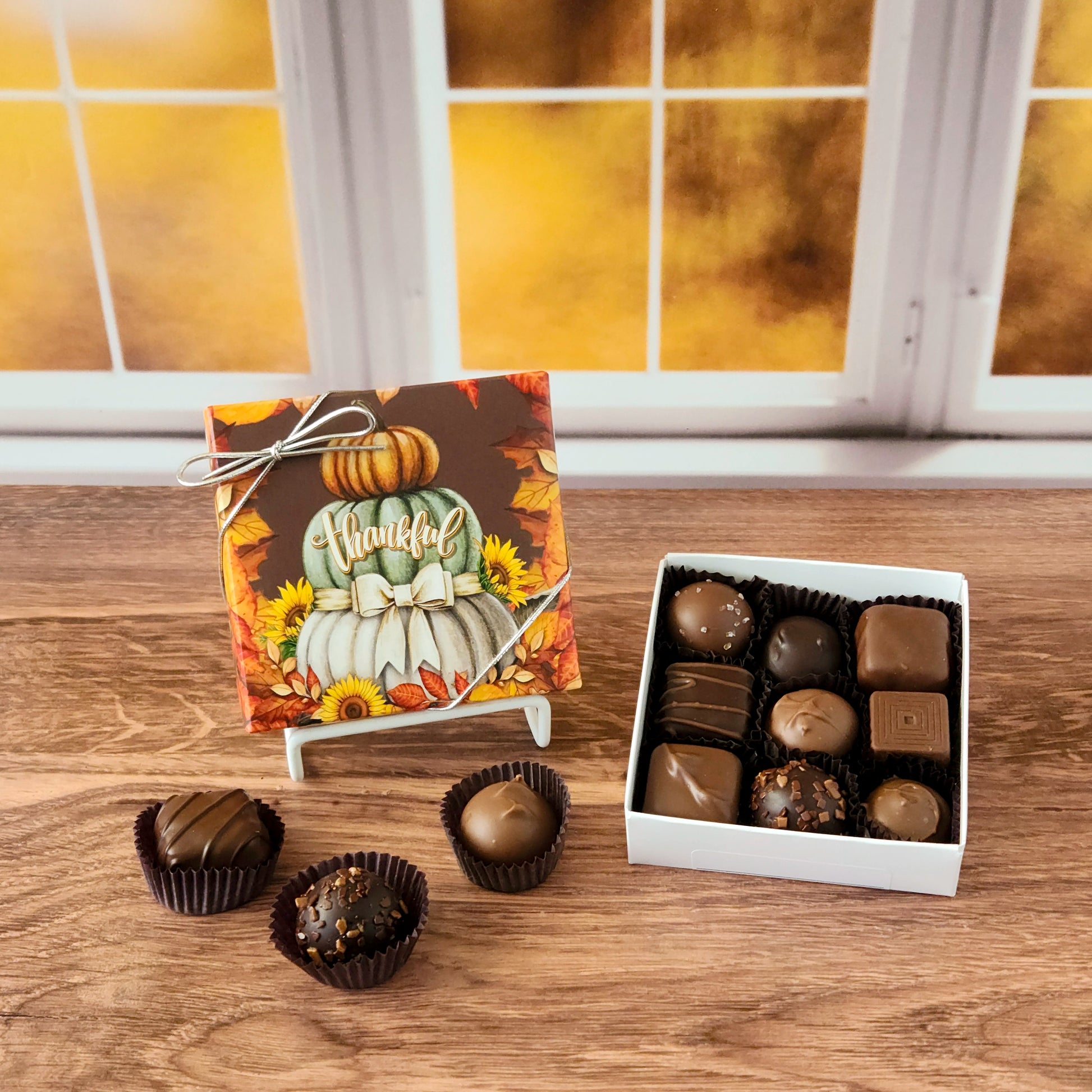 Celebrate the sweetness of the season with our Thankful Fall Chocolate Assortment!  Available in a 9-piece or 16-piece box, this collection is filled with rich milk and dark chocolates, crafted in small batches right here in our candy kitchen.  Each bite is a surprise of flavor and texture, featuring silky creams, gooey caramels, melt-in-your-mouth meltaways, and decadent truffles that capture everything we love about fall.