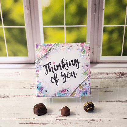 An assortment of our most popular milk and dark chocolate creams, caramels, melt-aways, and truffles all packed inside a floral Thinking of You printed box.