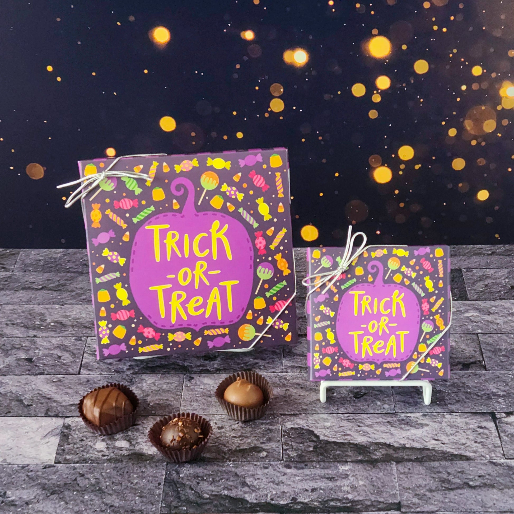 Enjoy a spellbinding variety of truffles, creams, caramels, and meltaways with our trick or treat milk and dark chocolate assortment box.  
Available in a 9 piece or 16 piece box