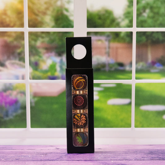 Our Stage Stop Select 4-Piece Truffle Box This charming set includes four handcrafted chocolate truffles in milk chocolate and dark chocolate.
Packaged in an elegant box that securely hangs from the neck of a wine, champagne, or a soda bottle, this gift set instantly transforms any bottle into a ready-to-give present.   Bring a sweet touch to every toast!