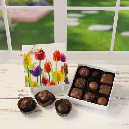 Say it with flowers—and chocolate! Our 9 piece Tulips Chocolate Box is a delightful way to brighten someone’s day with a beautiful blend of sights and tastes. Featuring a cheerful tulip design on the cover, this box is packed with Stage Stop Candy’s popular assortment of milk and dark chocolates. Handcrafted in small batches at our family-run Cape Cod shop, each piece is made with care to deliver that fresh, irresistible flavor we’re known for.