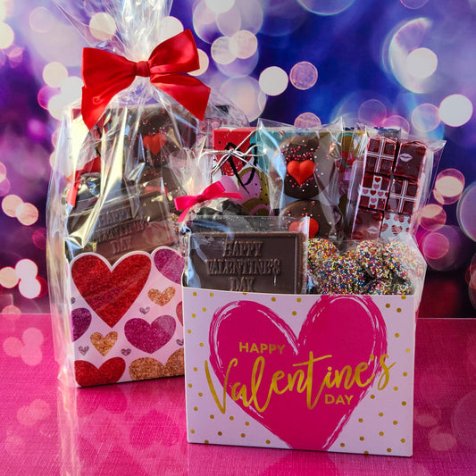 Make this Valentine’s Day unforgettable with our Valentine’s Day Gift Basket featuring:
Dark Chocolate Covered Cranberries, Milk Chocolate Oreos ,  Milk Chocolate Nonpareils, Milk Chocolate Foil Valentine’s Day Presents, 
A 16-piece Assortment and a festive Milk Chocolate Card that says Happy Valentine’s Day to complete the perfect gift