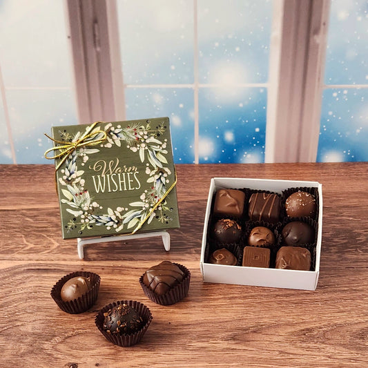 9 Piece Warm Wishes Chocolate Assortment.  Inside this beautifully decorated box is a handpicked selection of our most popular milk and dark chocolates.   You’ll discover a variety of gooey caramels, rich truffles, creamy centers, and smooth melt-aways