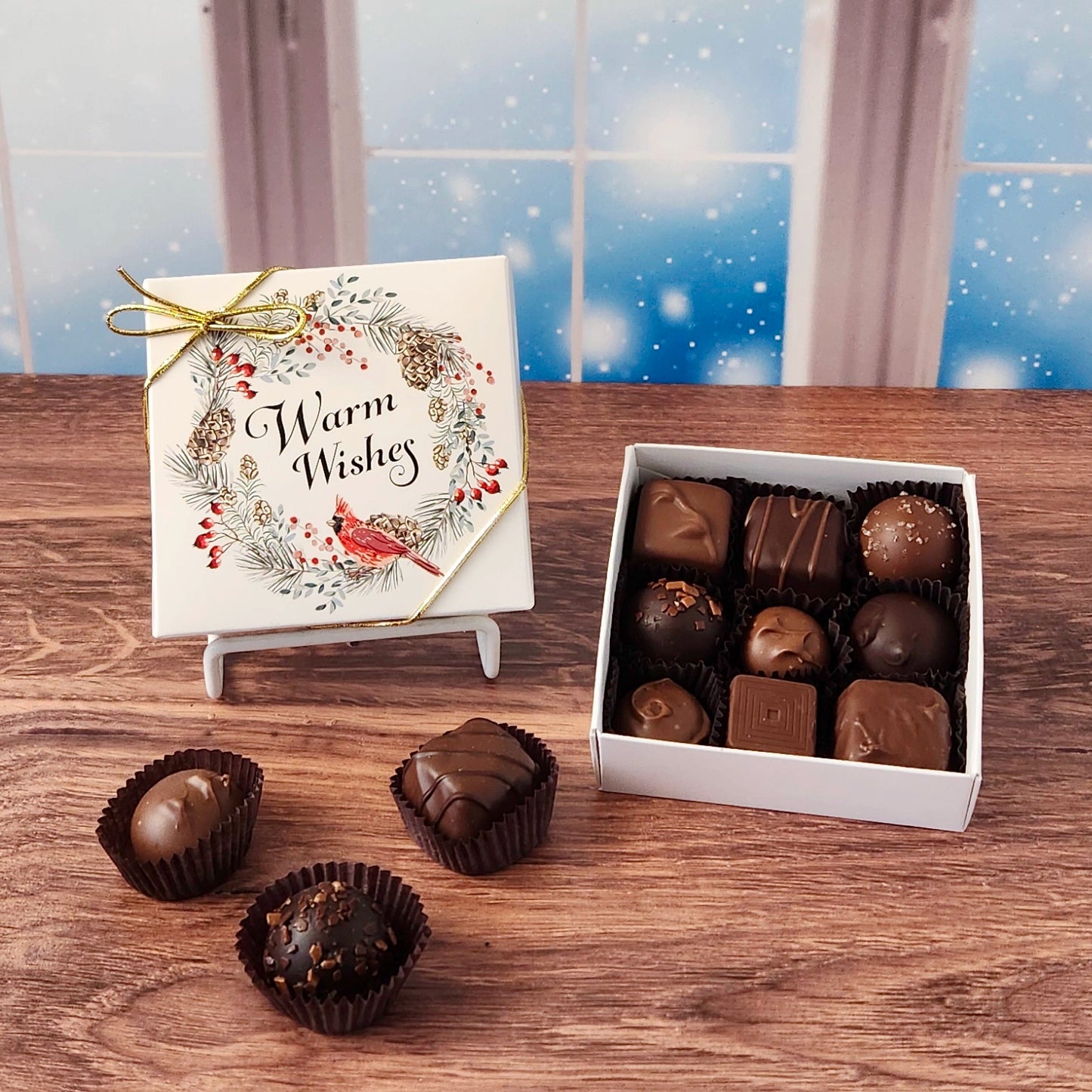 9 Piece Warm Wishes Cardinal Chocolate Assortment.  Inside this festive box is a handpicked selection of our most popular milk and dark chocolates.   You’ll discover a variety of gooey caramels, rich truffles, creamy centers, and smooth melt-aways