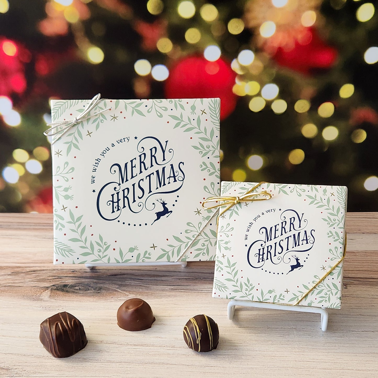 An assortment of our most popular milk and dark chocolate creams, caramels, melt-aways, and truffles all packed inside a box with the saying "We Wish You A Very Merry Christmas" printed on the cover.